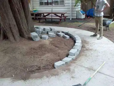 Circular Kids' Bike Track Around a Tree: concrete patio and wall work by Redmond Concrete, concrete contractor serving Woodinville (photo 5 of 6)