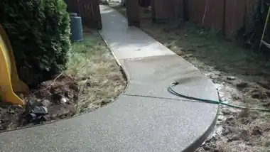 Curved Exposed Aggregate Walkway: concrete walkway and steps work by Redmond Concrete, concrete contractor serving Redmond (photo 1 of 6)
