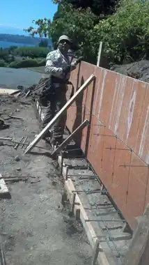 Driveway Extension & Retaining Wall in Bellevue, WA: concrete driveway work by Redmond Concrete (photo 2 of 6)