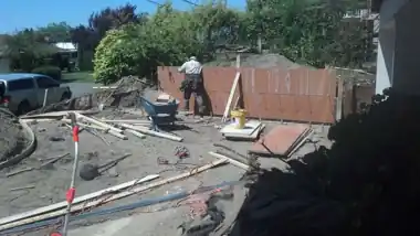 Driveway Extension & Retaining Wall in Bellevue, WA: concrete driveway work by Redmond Concrete (photo 3 of 6)