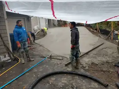 Tented Rainy-Season Driveway Pour: concrete driveway work by Redmond Concrete, concrete contractor serving Kirkland (photo 1 of 5)