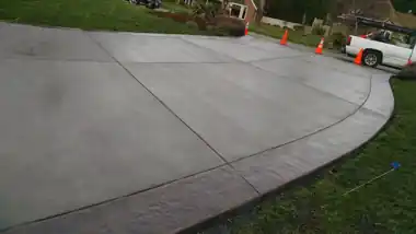 Driveway with Stamped Border: concrete driveway work by Redmond Concrete, concrete contractor serving Redmond (photo 1 of 3)
