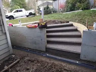 Another Firefighter’s Exposed Aggregate Patio & Round Steps in Bothell, WA: concrete patio and wall work by Redmond Concrete (photo 4 of 9)