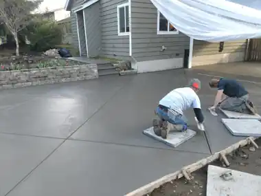 Stamped Patio & Broom-Finish Slab: concrete patio and wall work by Redmond Concrete, concrete contractor serving Redmond (photo 4 of 5)