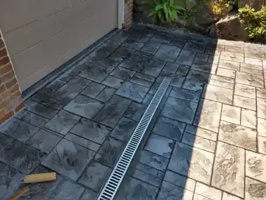Stamped Walk with Trench Drain: concrete walkway and steps work by Redmond Concrete, concrete contractor serving Bothell (photo 1 of 2)