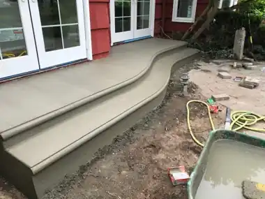 Wide Curved Steps over Pavers: concrete patio and wall work by Redmond Concrete, concrete contractor serving Kirkland (photo 1 of 2)